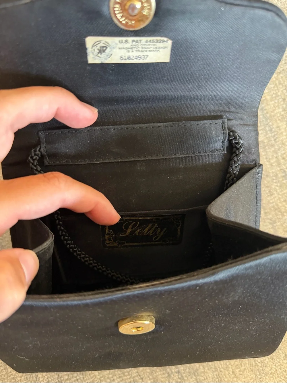 Black Satin Clutch with Gold-Tone Handle and Crystal Snake Accent